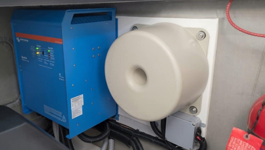 Marine-Puck Dual MP6 12 kVA isolation transformers installed under deck with central mounting bolt and epoxy-sealed housing visible