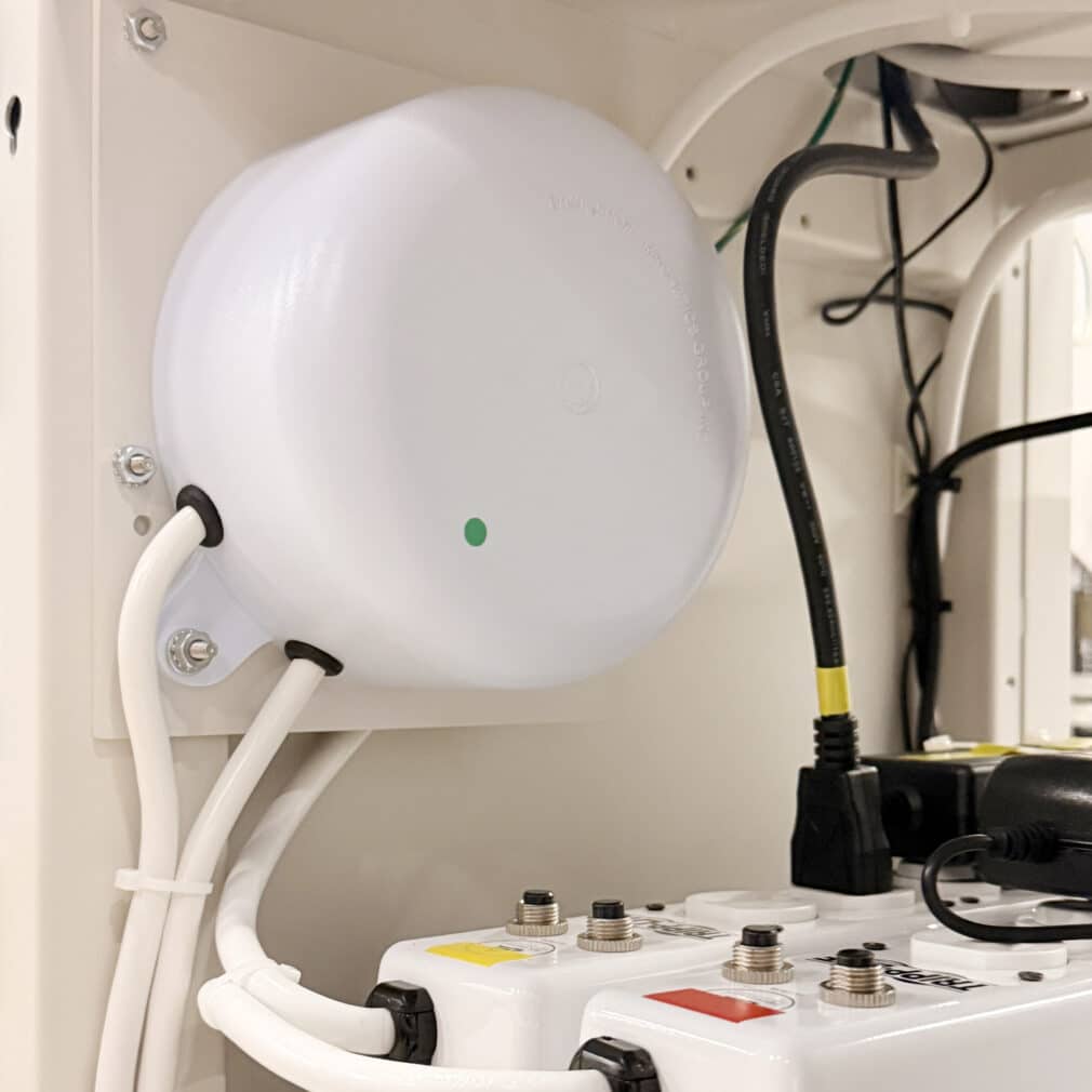 Compact ISO-PUCK isolation transformer mounted to a mobile medical cart used in a hospital procedure area.