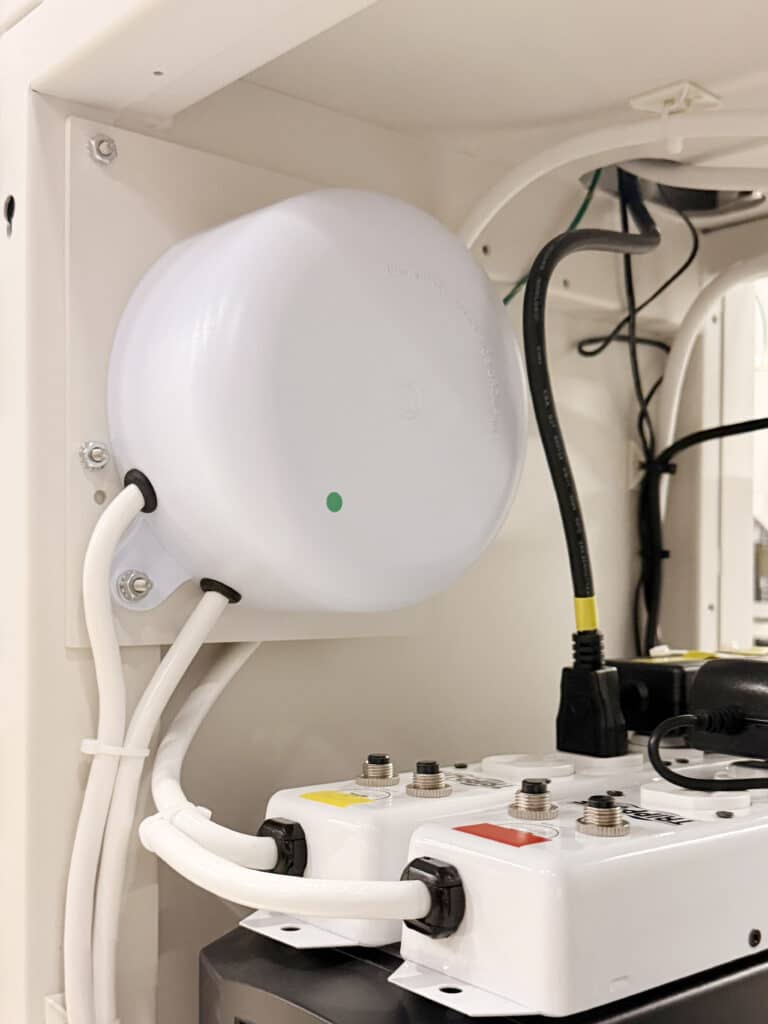Compact ISO-PUCK isolation transformer mounted to a mobile medical cart used in a hospital procedure area.